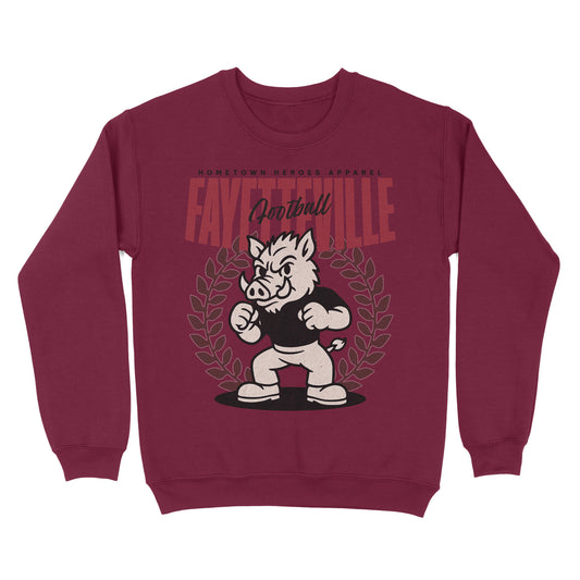Maroon sweatshirt with a graphic of a boar mascot and text on a white background
