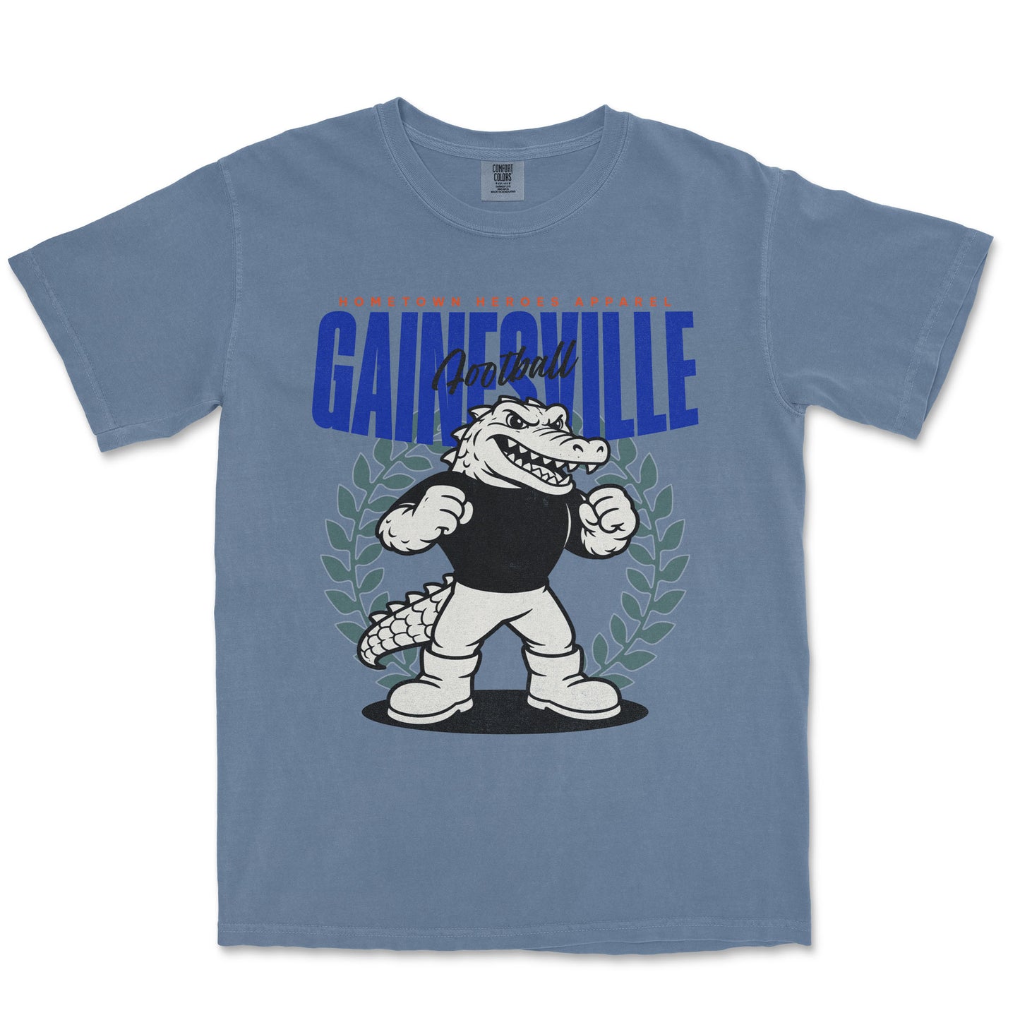 Blue t-shirt with a cartoon alligator and 'Gainesville' text on a white background