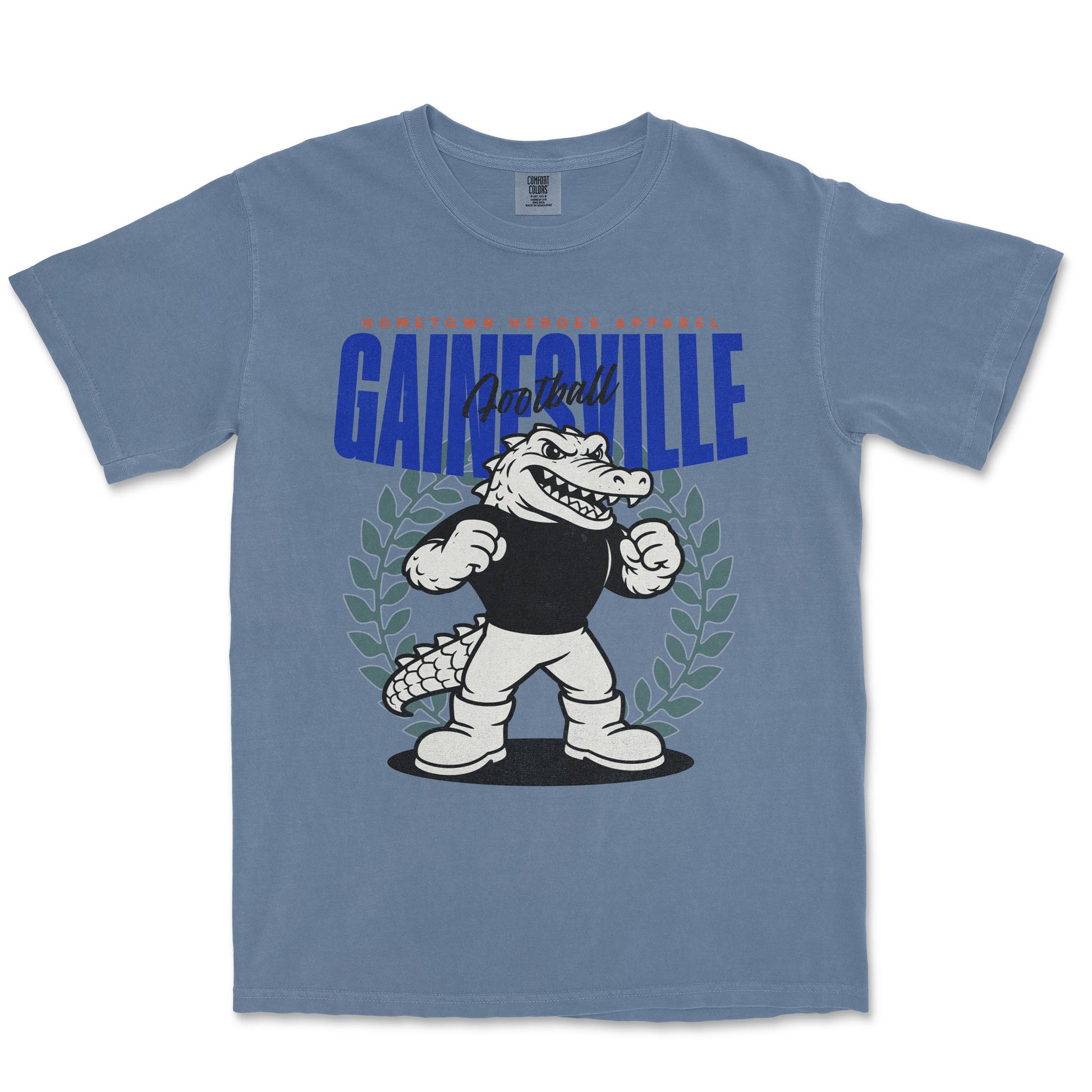 Blue t-shirt with a cartoon alligator and 'Gainesville' text on a white background