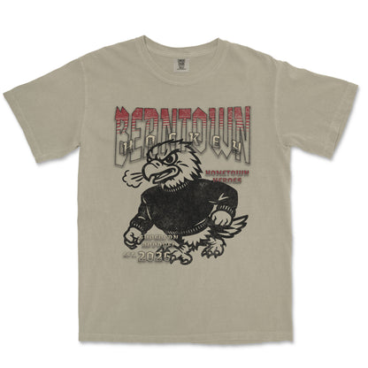 Beige t-shirt with an eagle graphic and text on a white background