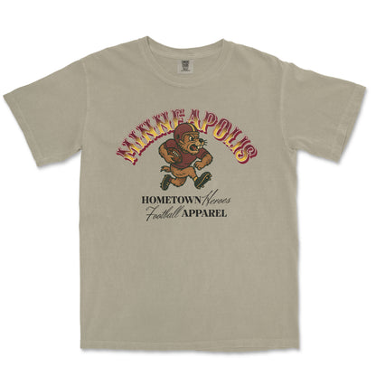 Beige t-shirt with 'Minneapolis' and football graphic on a white background