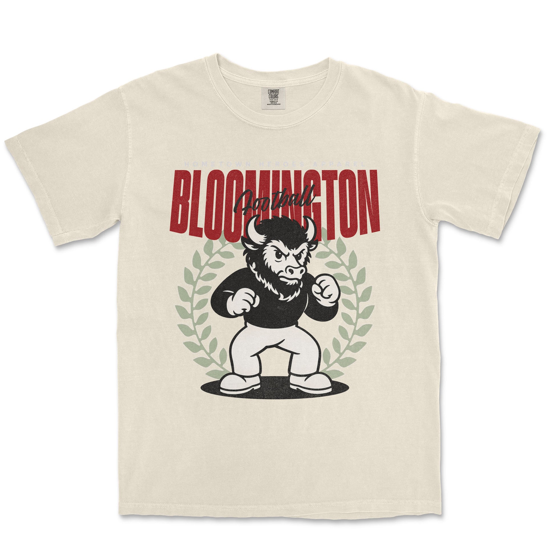 Beige t-shirt with a graphic of a bull and text 'I am from Bloomington' on a white background