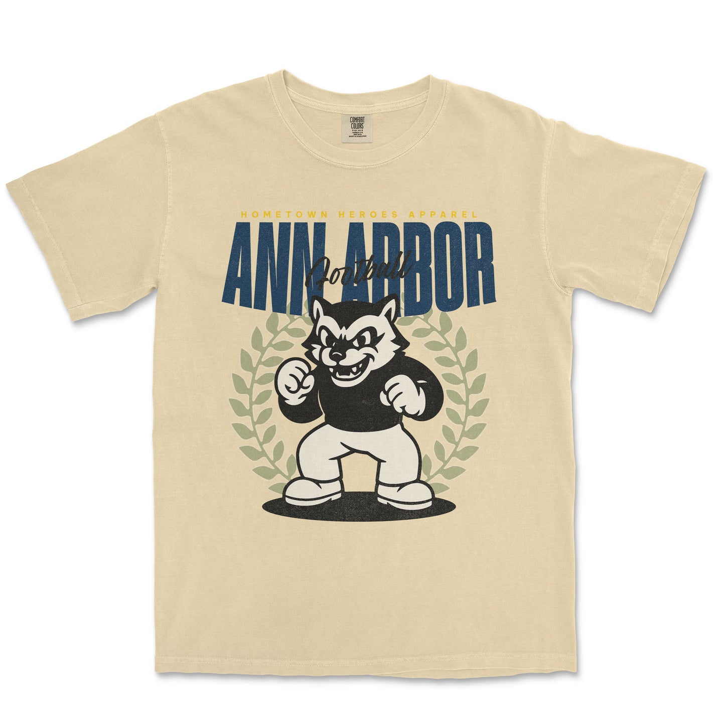 Beige t-shirt with a graphic of a cartoon character and 'Ann Arbor' text on a white background