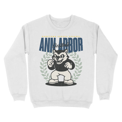 White sweatshirt with 'Ann Arbor United' text and cartoon character on a white background