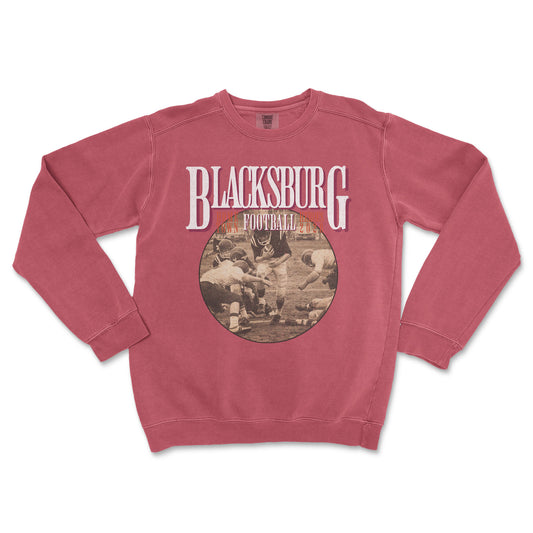 Red sweatshirt with 'Blacksburg Football' print on a white background