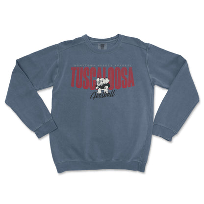 Blue sweatshirt with 'Tuscaloosa Football' text and logo on a white background