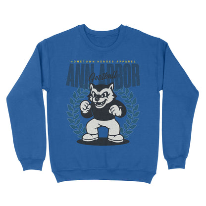Blue sweatshirt with a cartoon wolf mascot and 'Ann Arbor' text on a white background