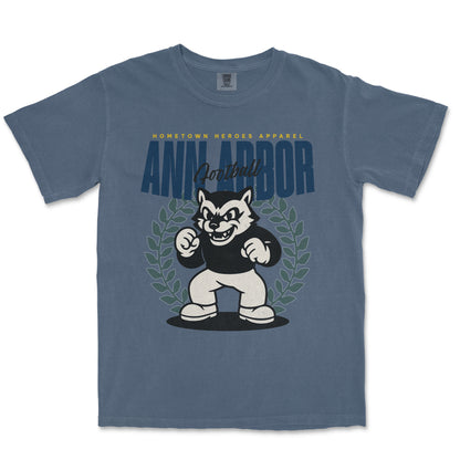 Blue t-shirt with a cartoon bear graphic and 'Ann Arbor' text on a white background