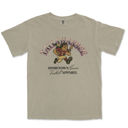 Beige t-shirt with football-themed graphic and text on a white background