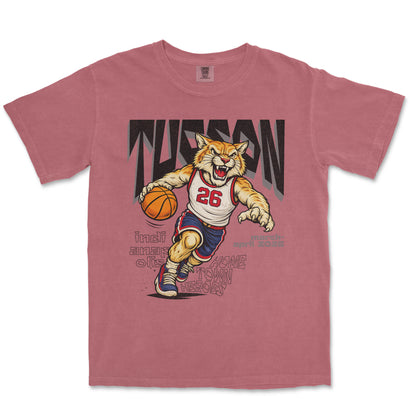 Pink t-shirt with a tiger basketball player graphic on a white background