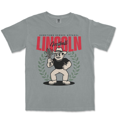 Gray t-shirt with a graphic design featuring a character holding corn and the word 'Lincoln'.