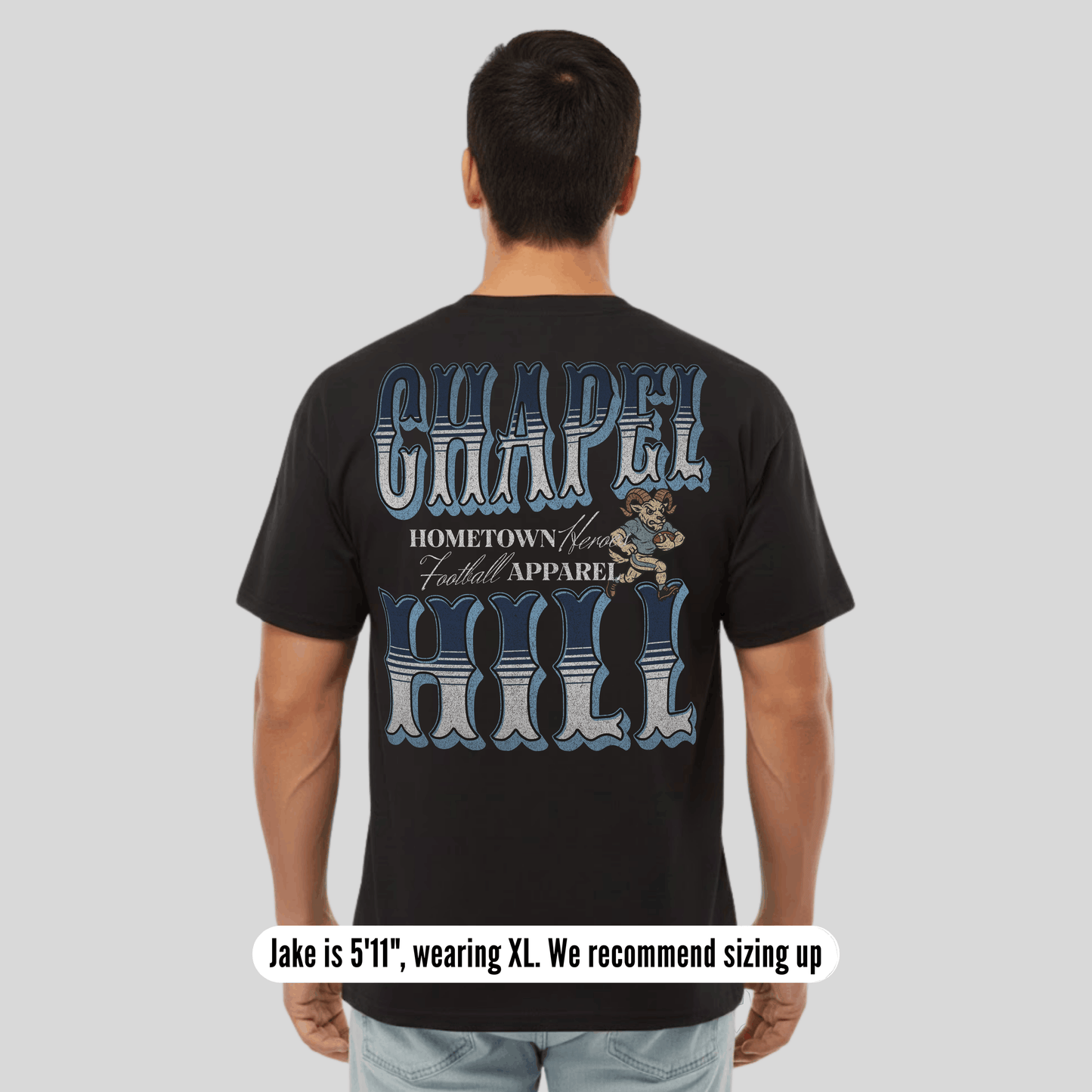 Person wearing a black t-shirt with 'Chapel Hill' text and graphics on the back, on a plain background.