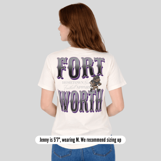 Person wearing a white t-shirt with 'Fort Worth' printed on the back, on a plain background.