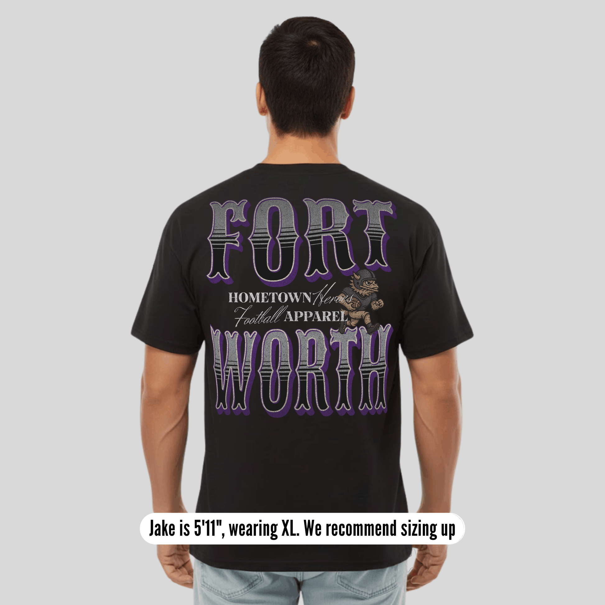 Person wearing a black t-shirt with 'Fort Worth' text and graphic on the back, on a plain background.