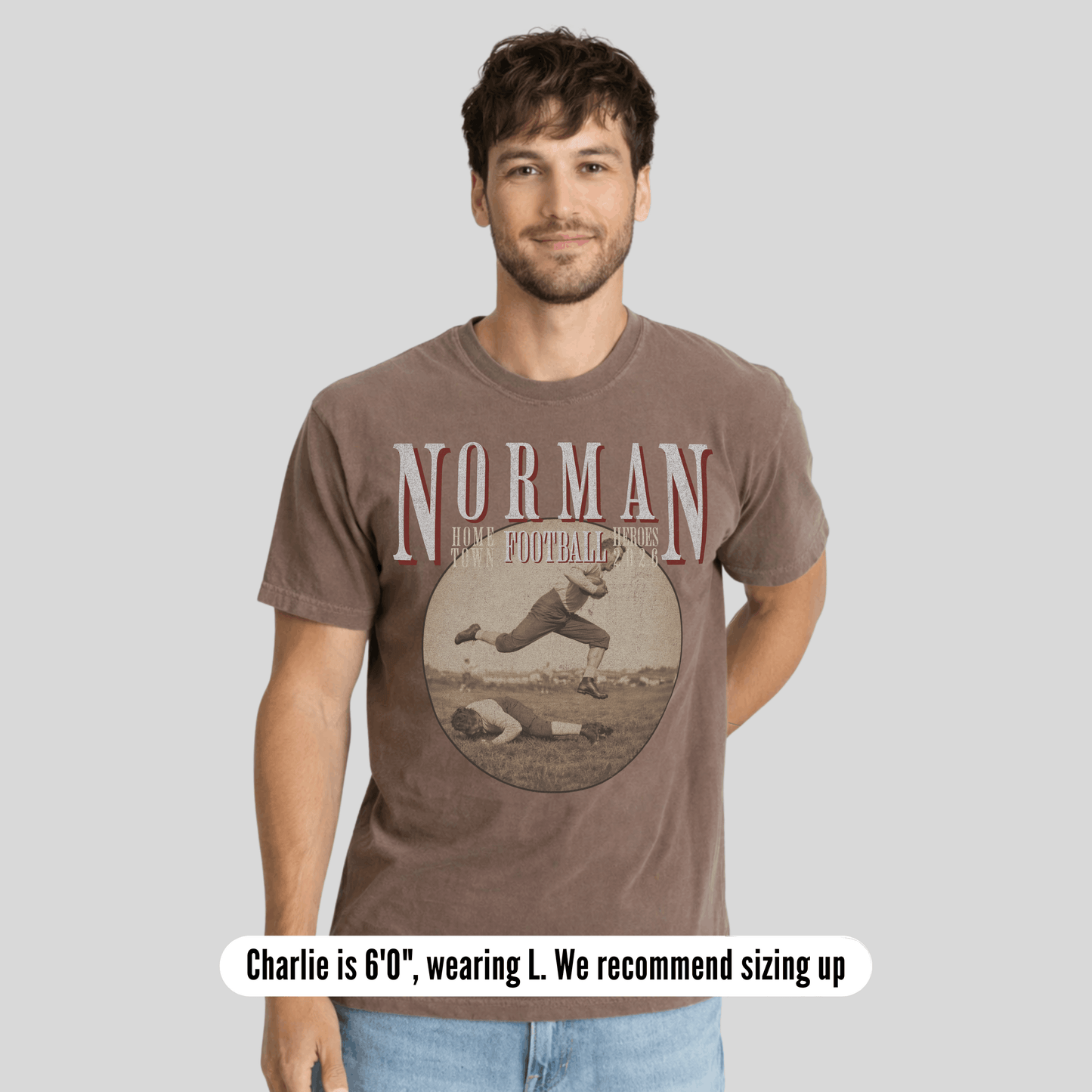 Man wearing a brown t-shirt with 'Norman Football' design on a gray background