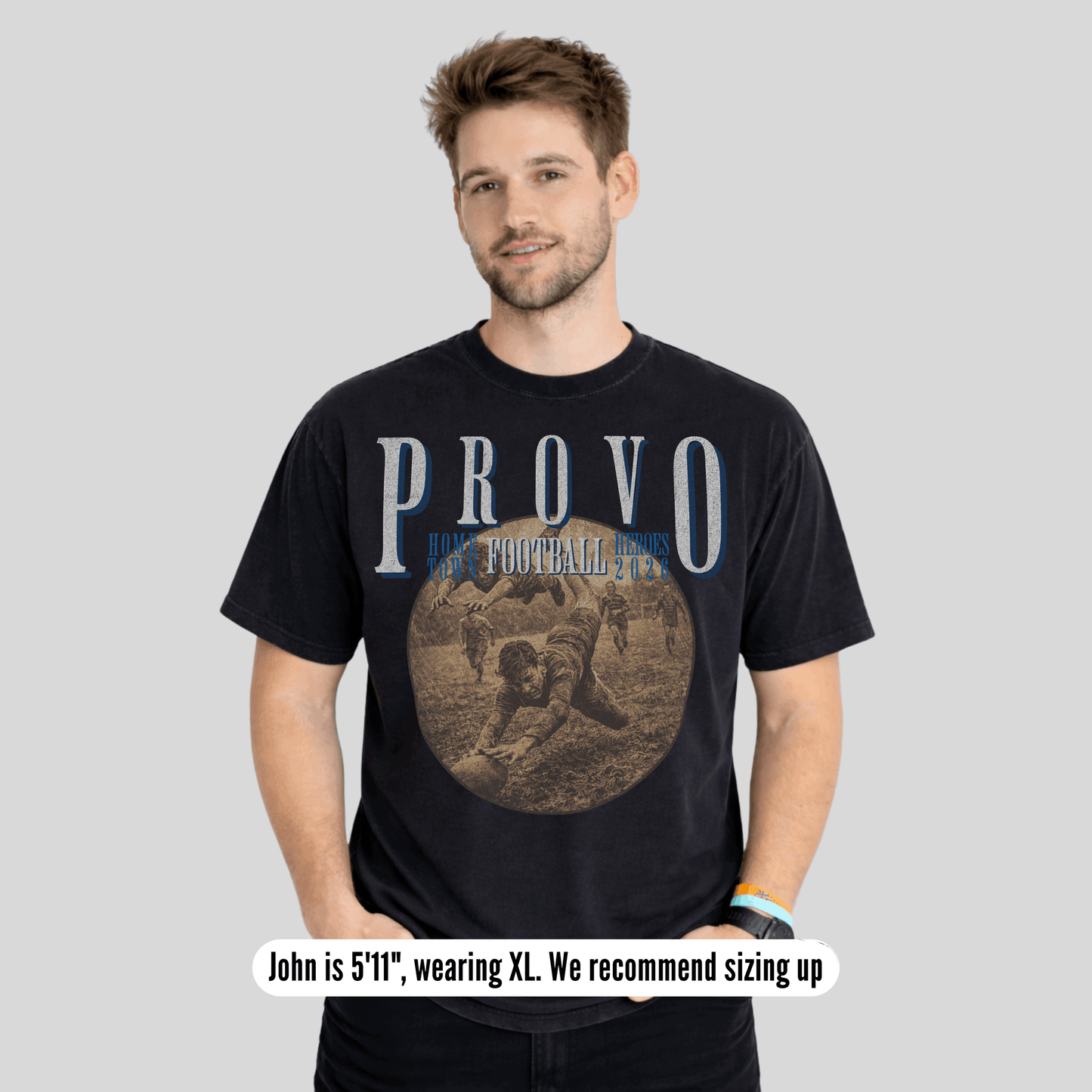 Man wearing a black t-shirt with 'PROVO' printed on it against a gray background