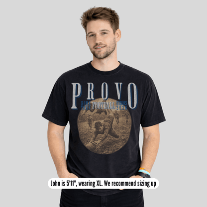 Man wearing a black t-shirt with 'PROVO' printed on it against a gray background