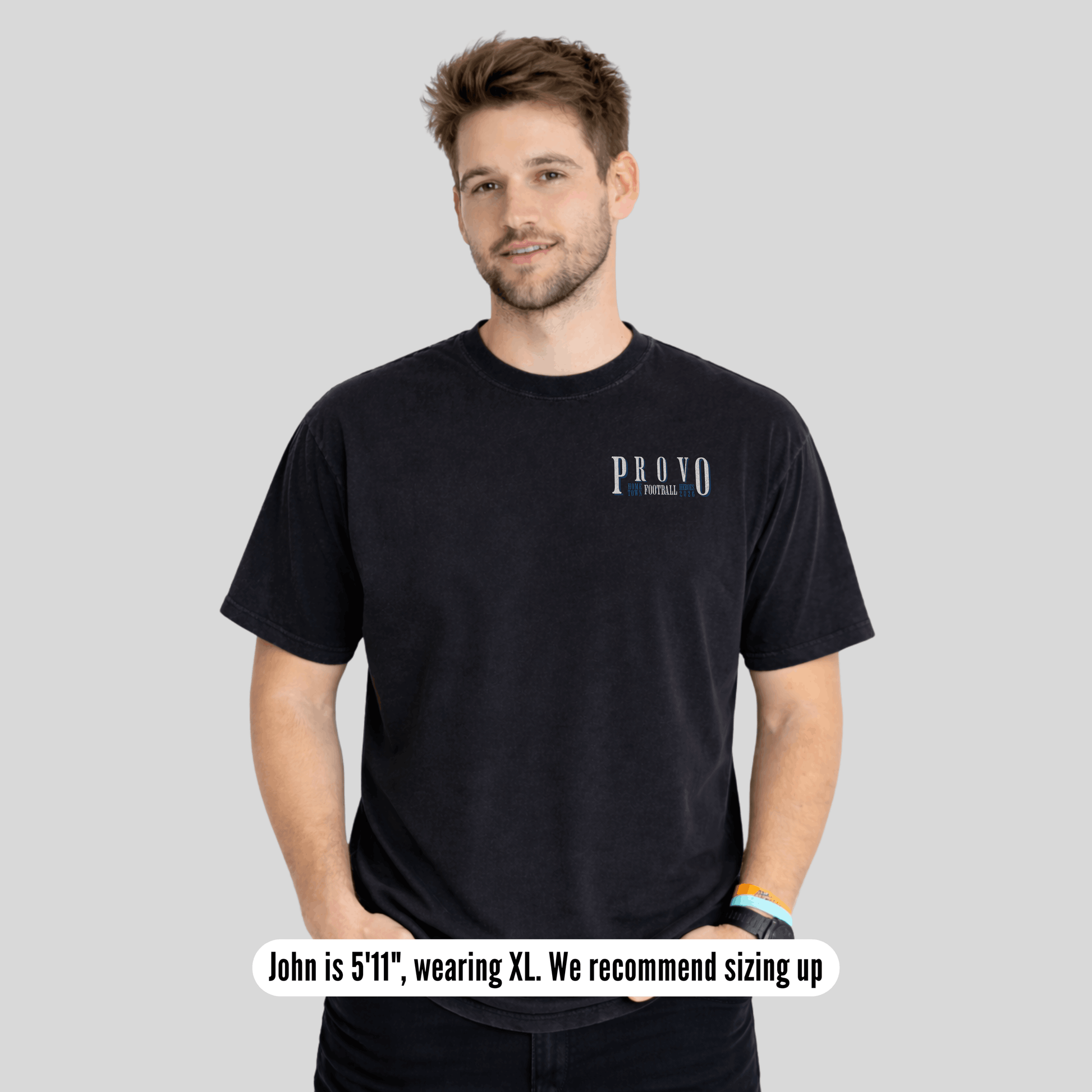 Man wearing a black t-shirt with 'PROVO' branding on a gray background