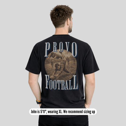 Man wearing a black t-shirt with 'Provo Football' design on the back against a gray background
