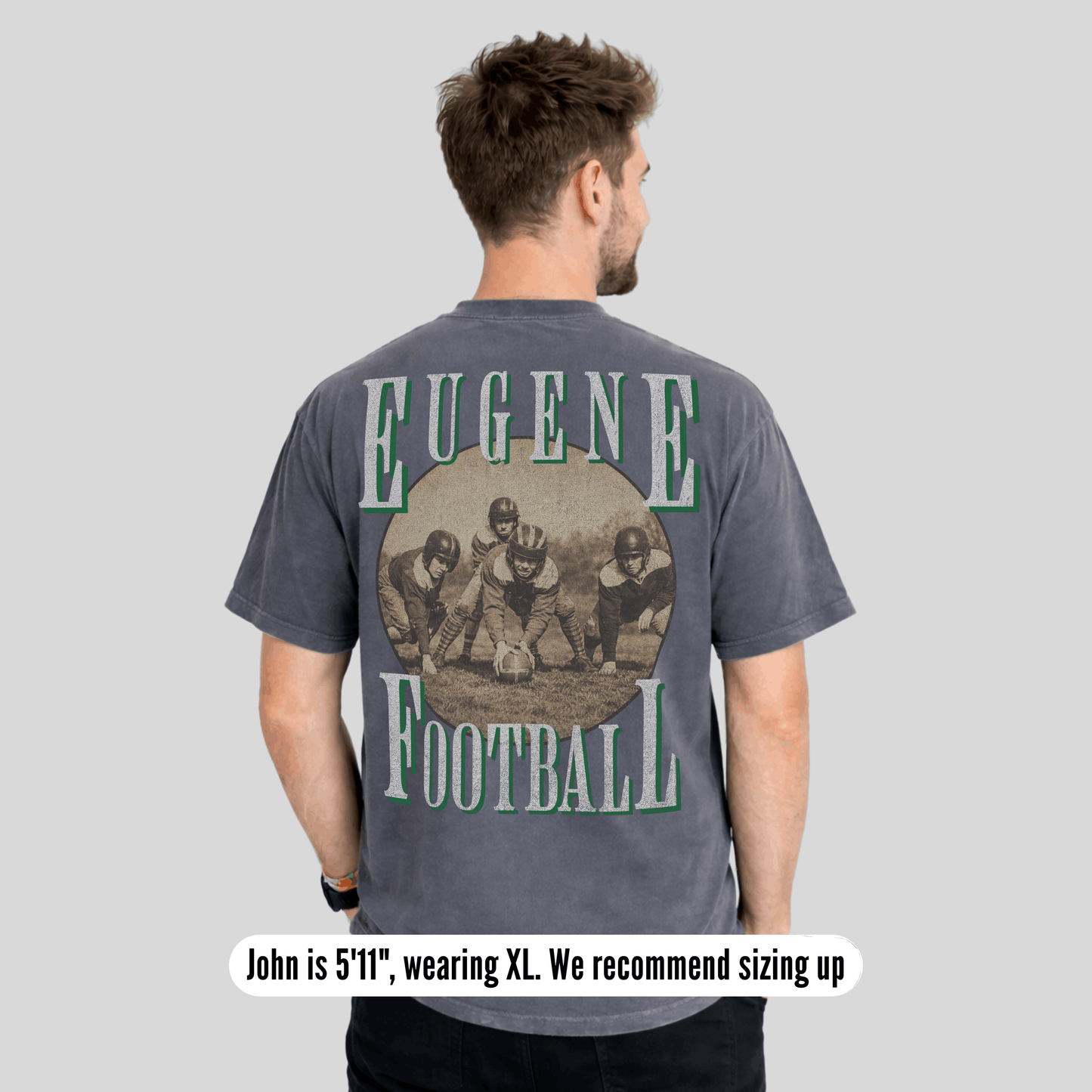 Man wearing a gray t-shirt with 'Eugene Football' print on the back, on a light gray background.