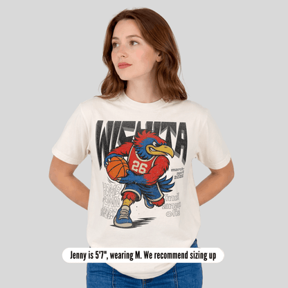 Woman wearing a white t-shirt with a graphic design of a cartoon character holding a basketball on a gray background.