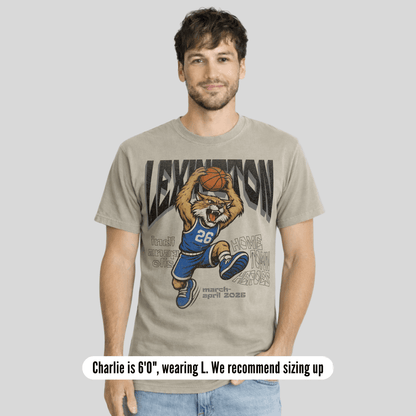 Man wearing a t-shirt with a graphic design of a tiger holding a basketball and text.
