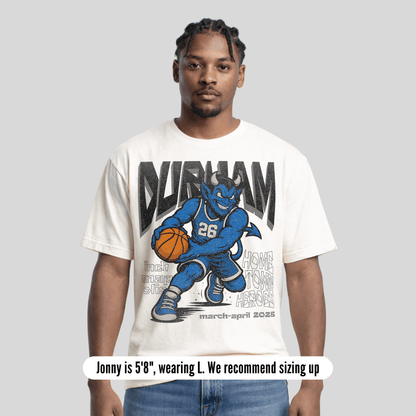Man wearing a 'Durham' t-shirt with a graphic design on a gray background