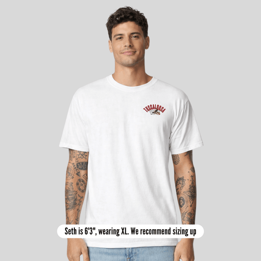 Man wearing a white t-shirt with a logo on a gray background