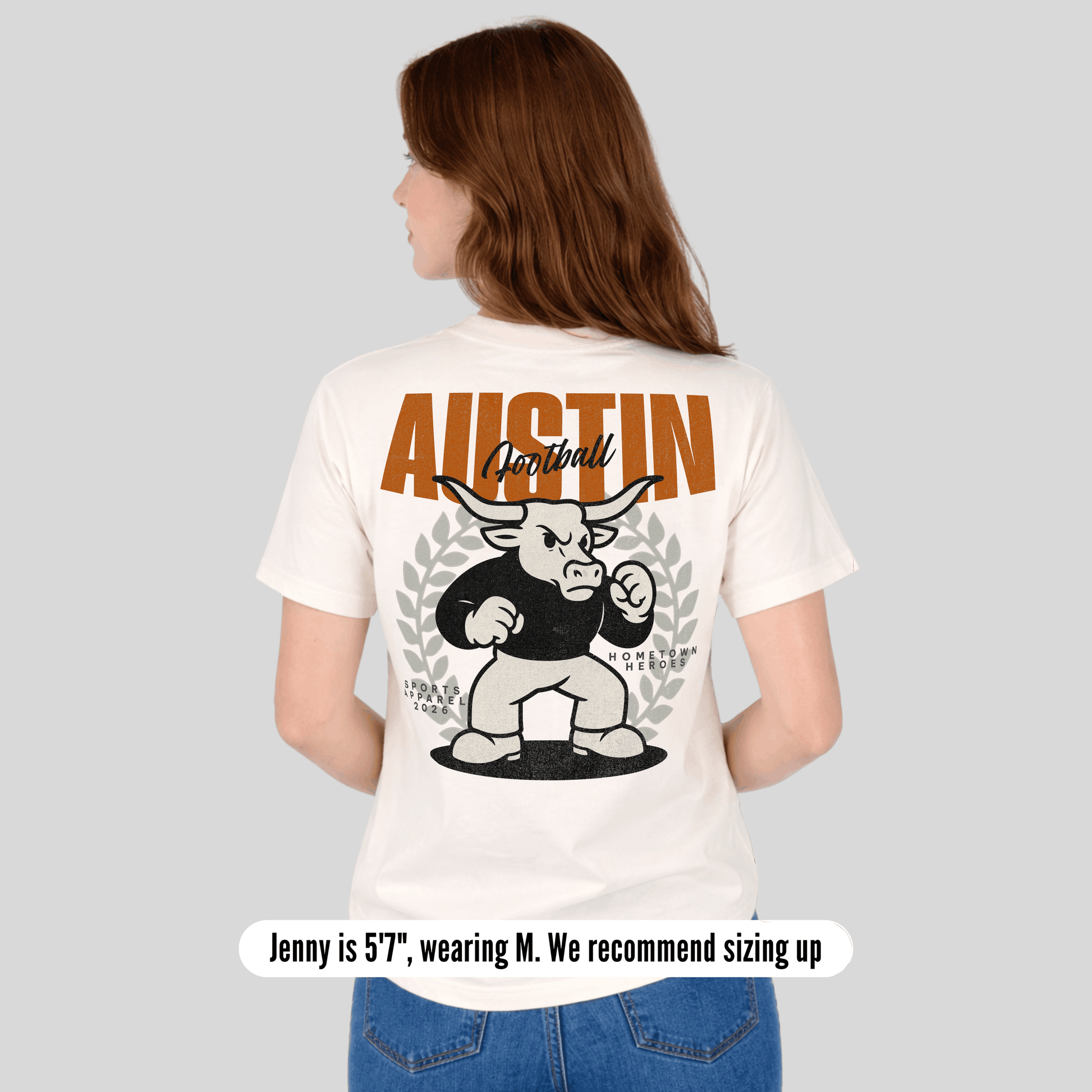 Person wearing a white t-shirt with 'Austin Football' design on the back, standing against a plain background.