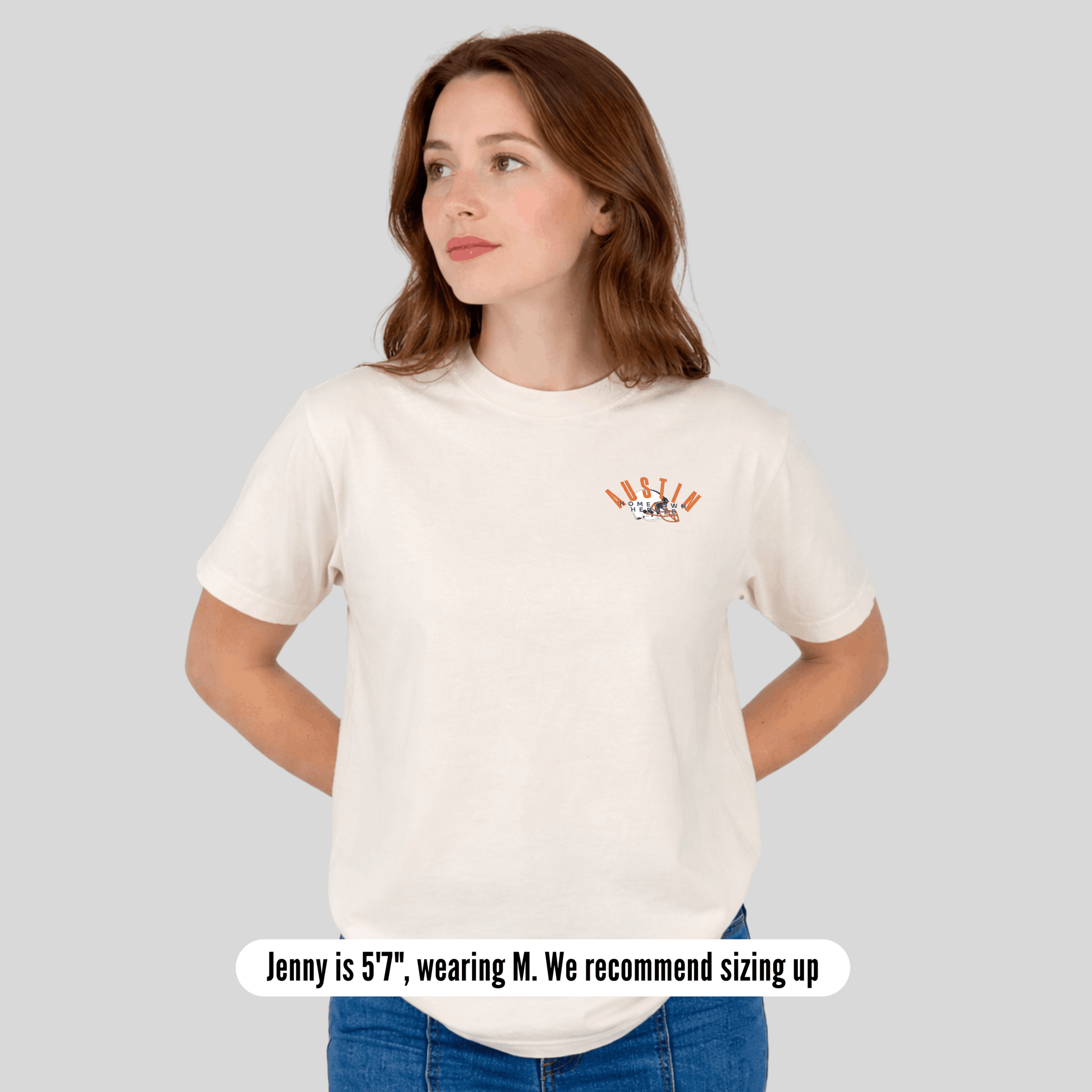 Woman wearing a white t-shirt with a logo on a gray background
