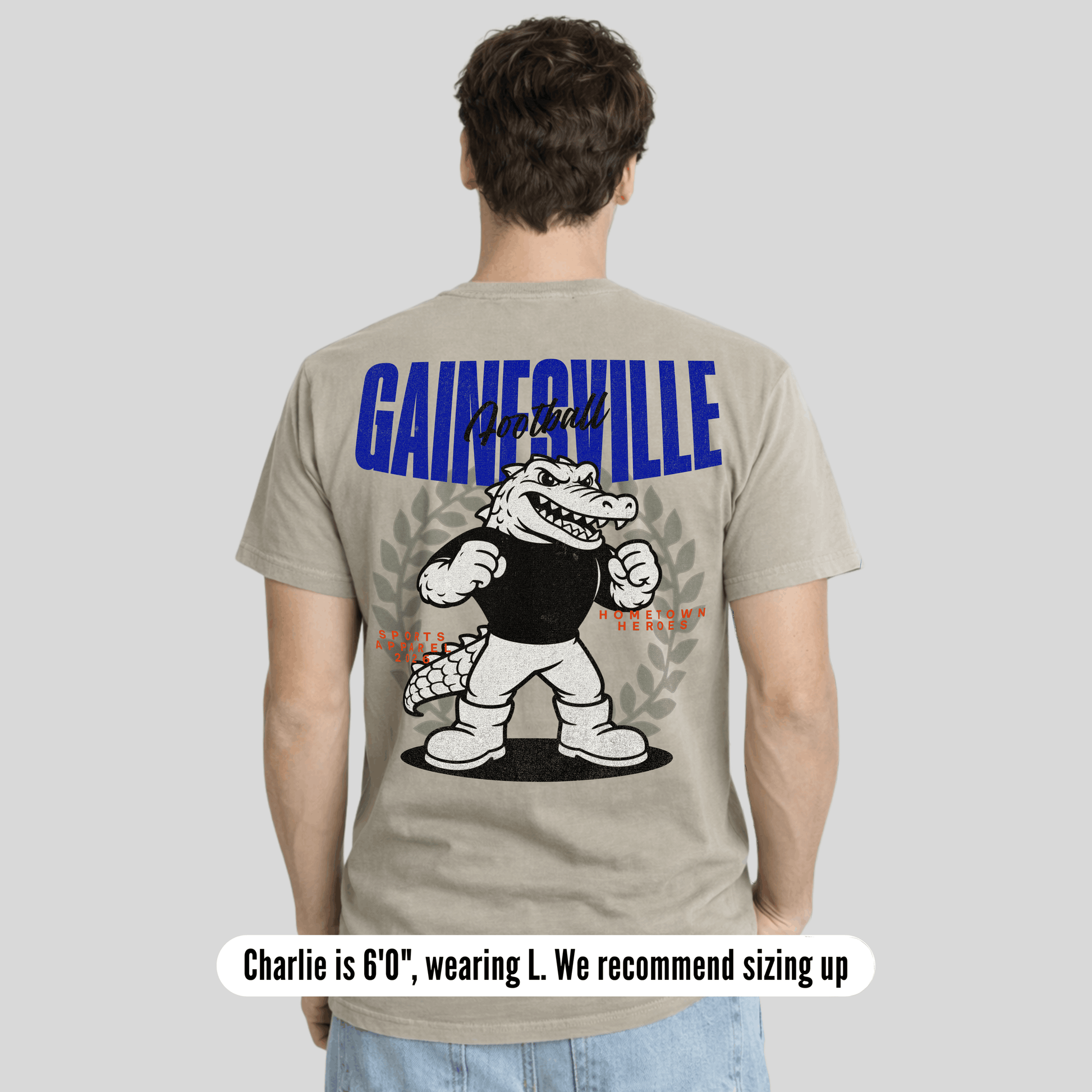 Person wearing a t-shirt with 'Gainesville' and an alligator graphic on the back.