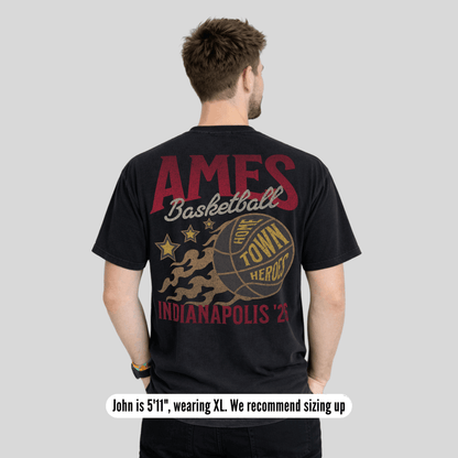 Man wearing a black t-shirt with 'AMES Basketball Home Town Hero Indianapolis 2021' design on the back.