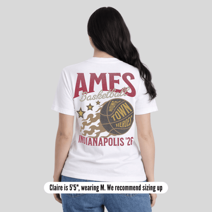 Person wearing a white t-shirt with 'AMES Basketball Town Hero Indianapolis 26' design on a plain background
