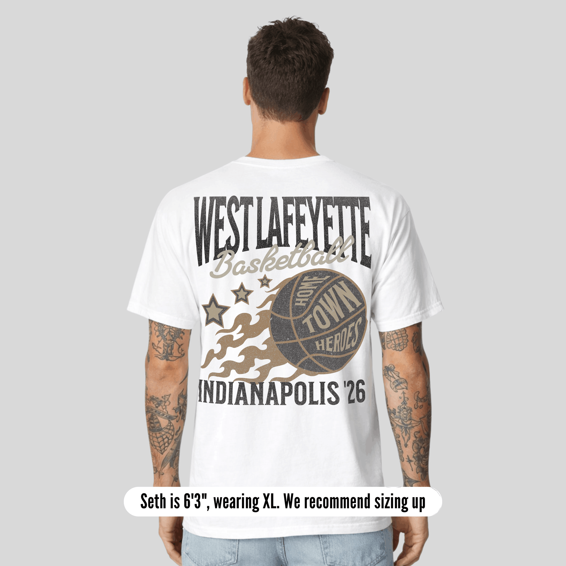 Person wearing a white t-shirt with 'West Lafayette Basketball' design on the back, standing against a gray background.