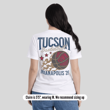 Person wearing a white t-shirt with 'Tucson Basketball' and 'Indianapolis '26' design on a plain background