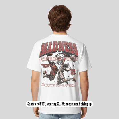 Person wearing a white t-shirt with graphic design and text on the back, on a plain background.