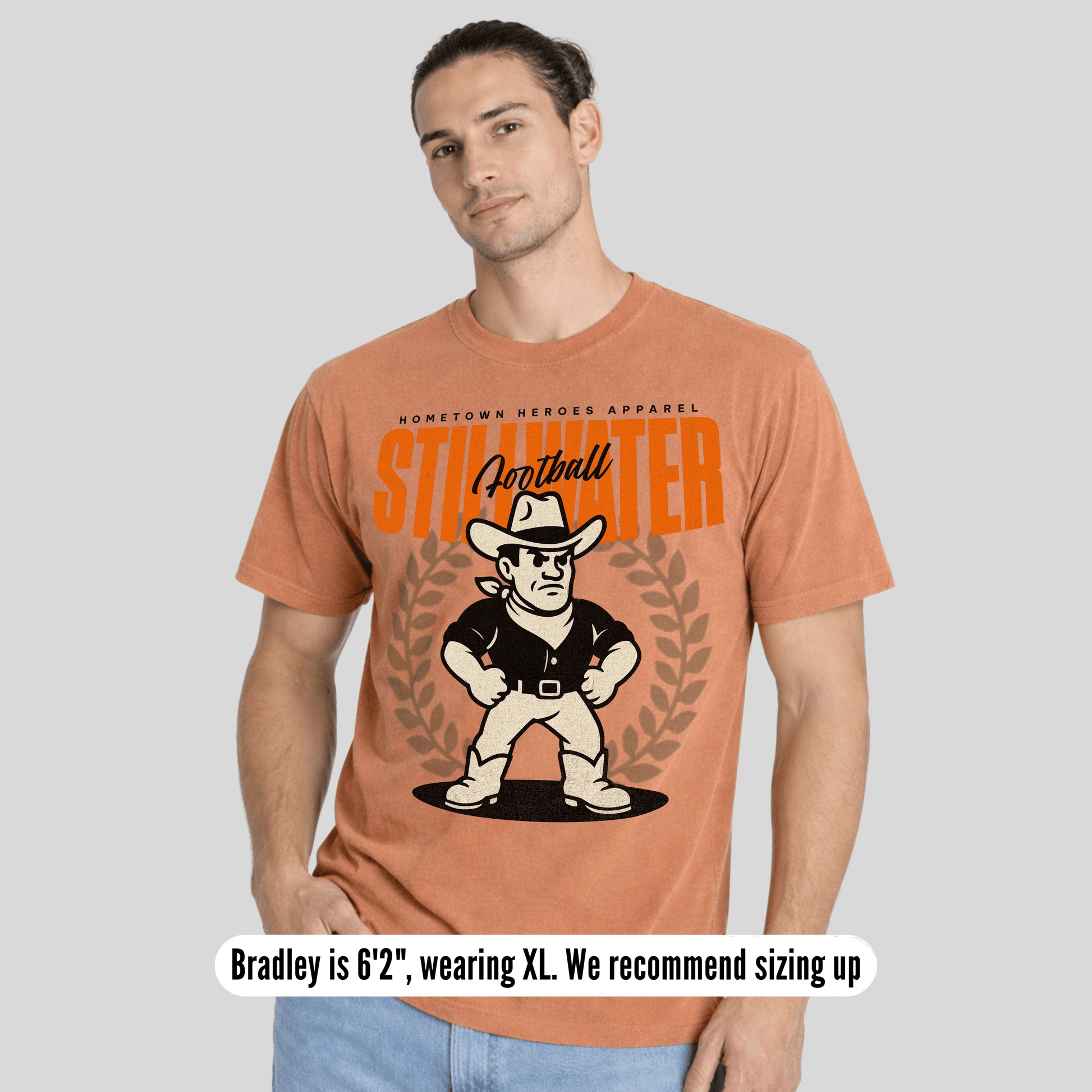 Man wearing a t-shirt with a graphic design and text on a plain background
